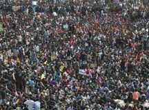 People attend a protest demanding to reverse a Supreme Court ban on the traditional bull-taming contests, known as Jallikattu, at the Marina beach in Chennai