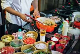 Chef Ranjit Thomas cooking in Le Creuset Cookware