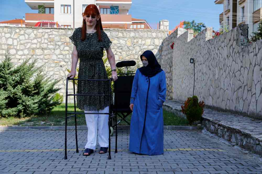 Rumeysa Gelgi: Turkish woman who is more than 7 foot named world's